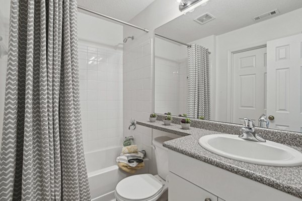 Bathroom with modern fixtures at The Vinings at Duncan Chapel Apartments, offering luxury living and convenience for residents