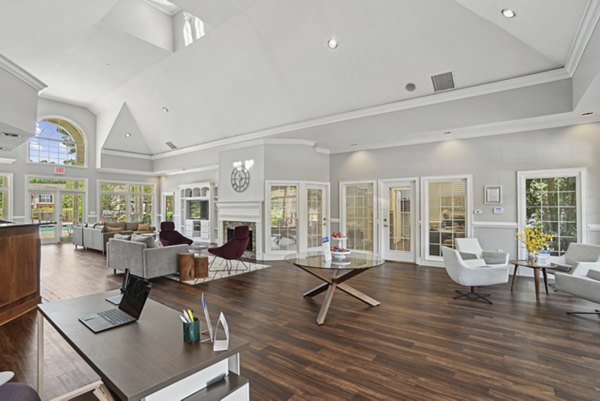 Modern clubhouse with spacious seating at The Vinings at Duncan Chapel Apartments for social gatherings and events