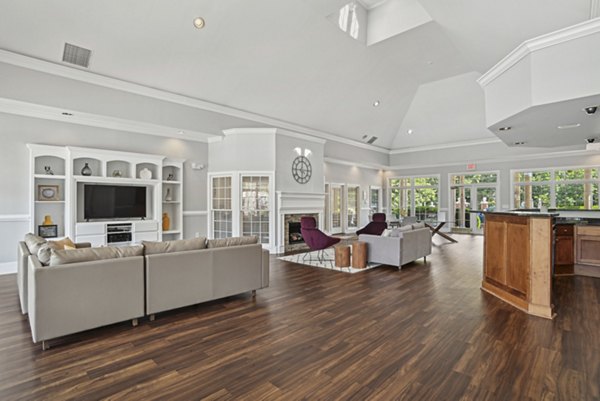 Clubhouse with modern decor and spacious seating at The Vinings at Duncan Chapel Apartments, offering luxury leisure space for residents
