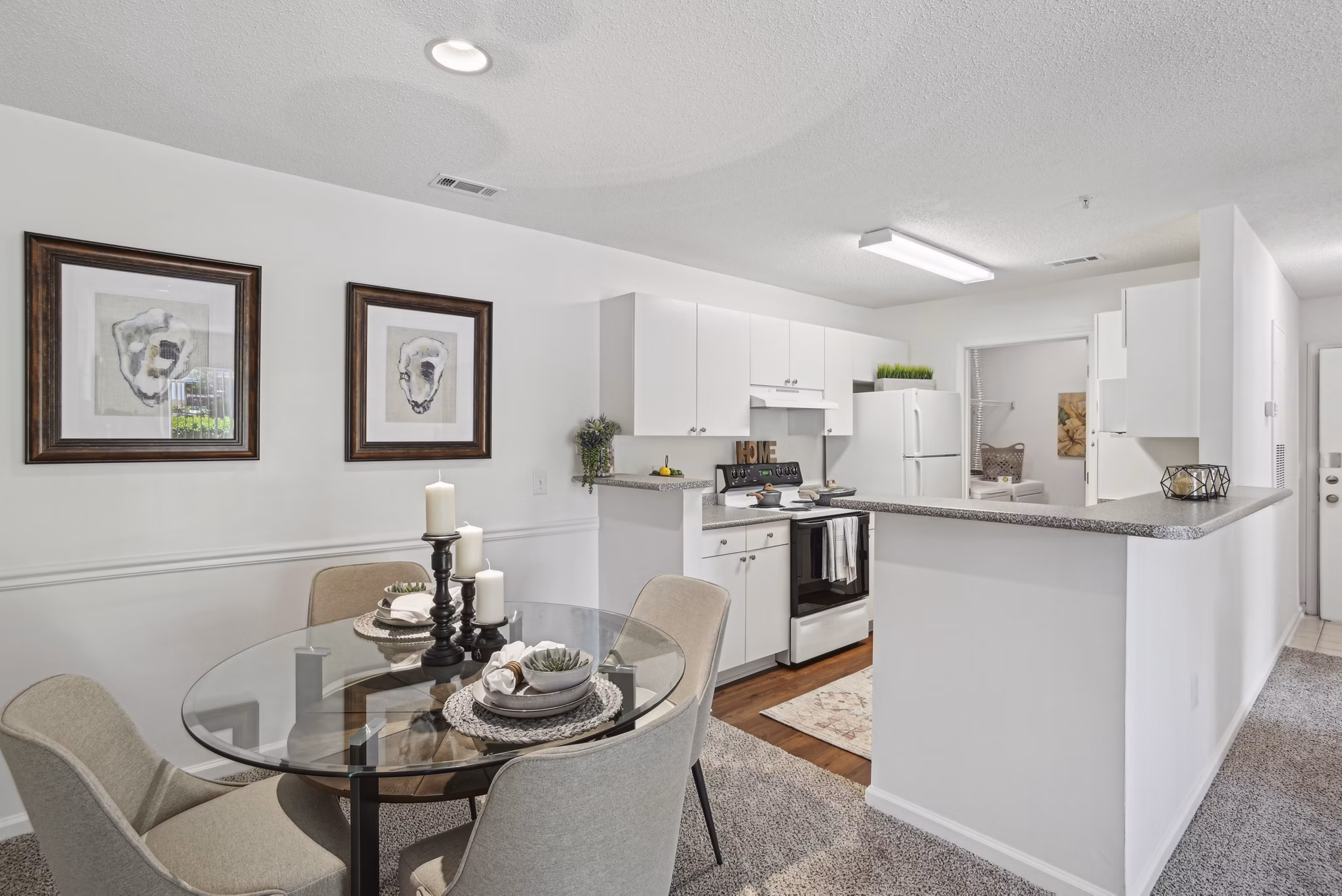 Modern dining area with elegant lighting at The Vinings at Duncan Chapel Apartments