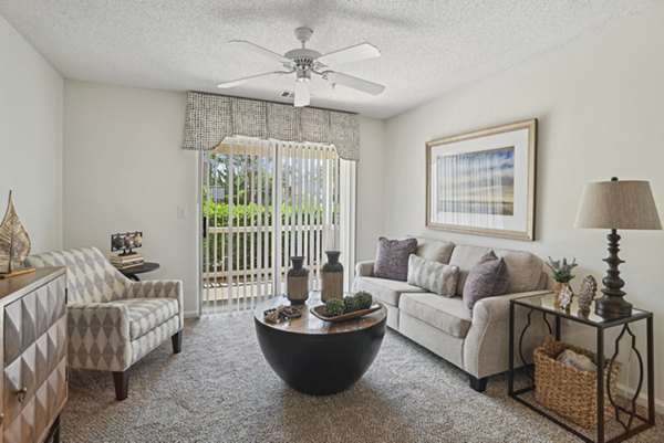 Bright living room with modern decor at The Vinings at Duncan Chapel Apartments