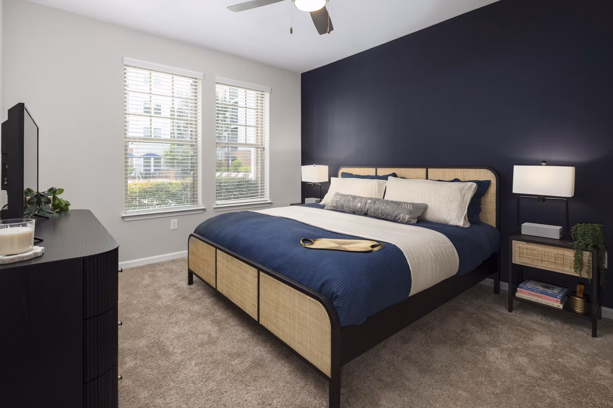 Cozy bedroom with elegant decor at Avanti Brookhaven Apartments
