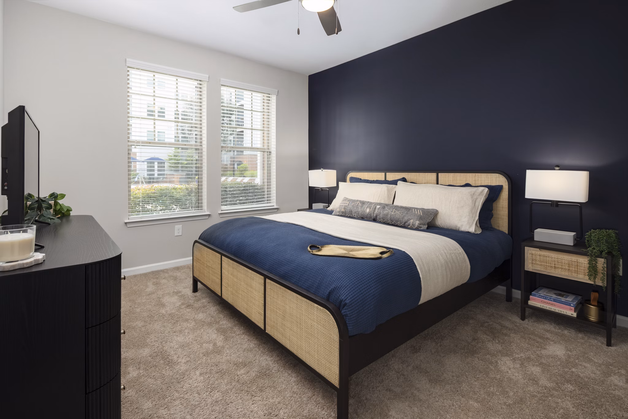 Cozy bedroom with elegant decor at Avanti Brookhaven Apartments