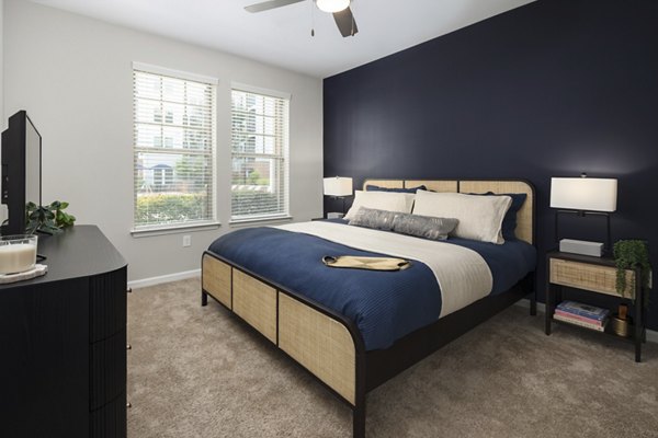 Cozy bedroom with elegant decor at Avanti Brookhaven Apartments