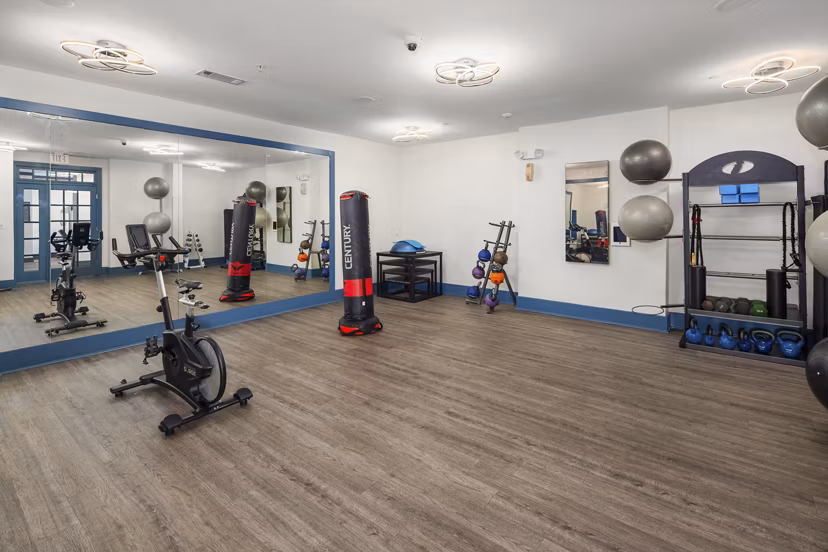 Modern fitness center with advanced equipment at Avanti Brookhaven Apartments offering luxurious amenities for residents