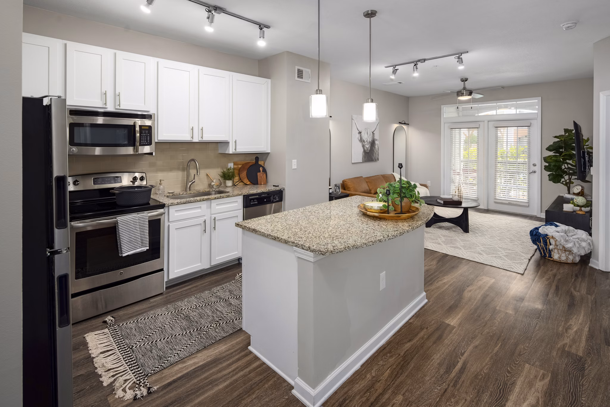 Kitchen featuring modern appliances and sleek countertops at Avanti Brookhaven Apartments
