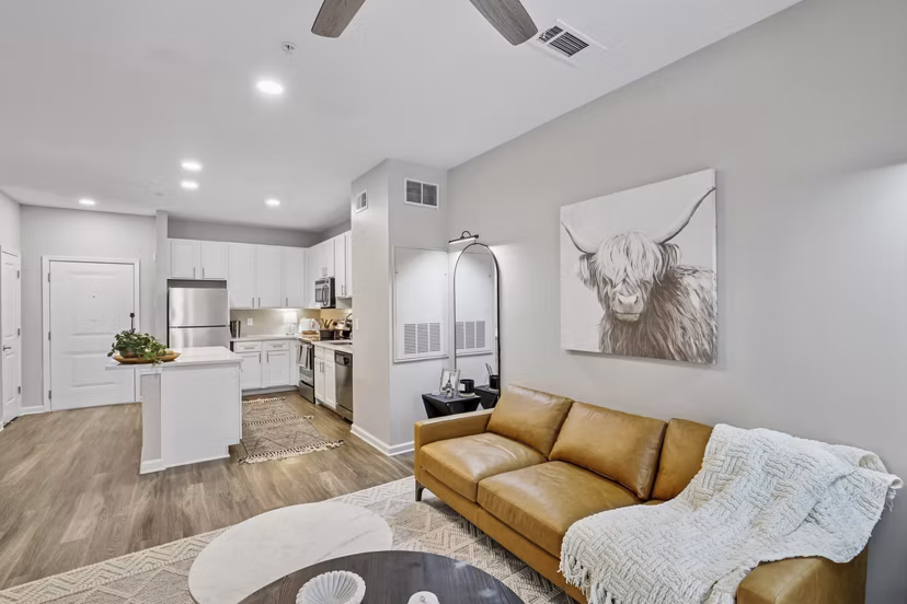 Living room with modern design and ample natural light at Avanti Brookhaven Apartments