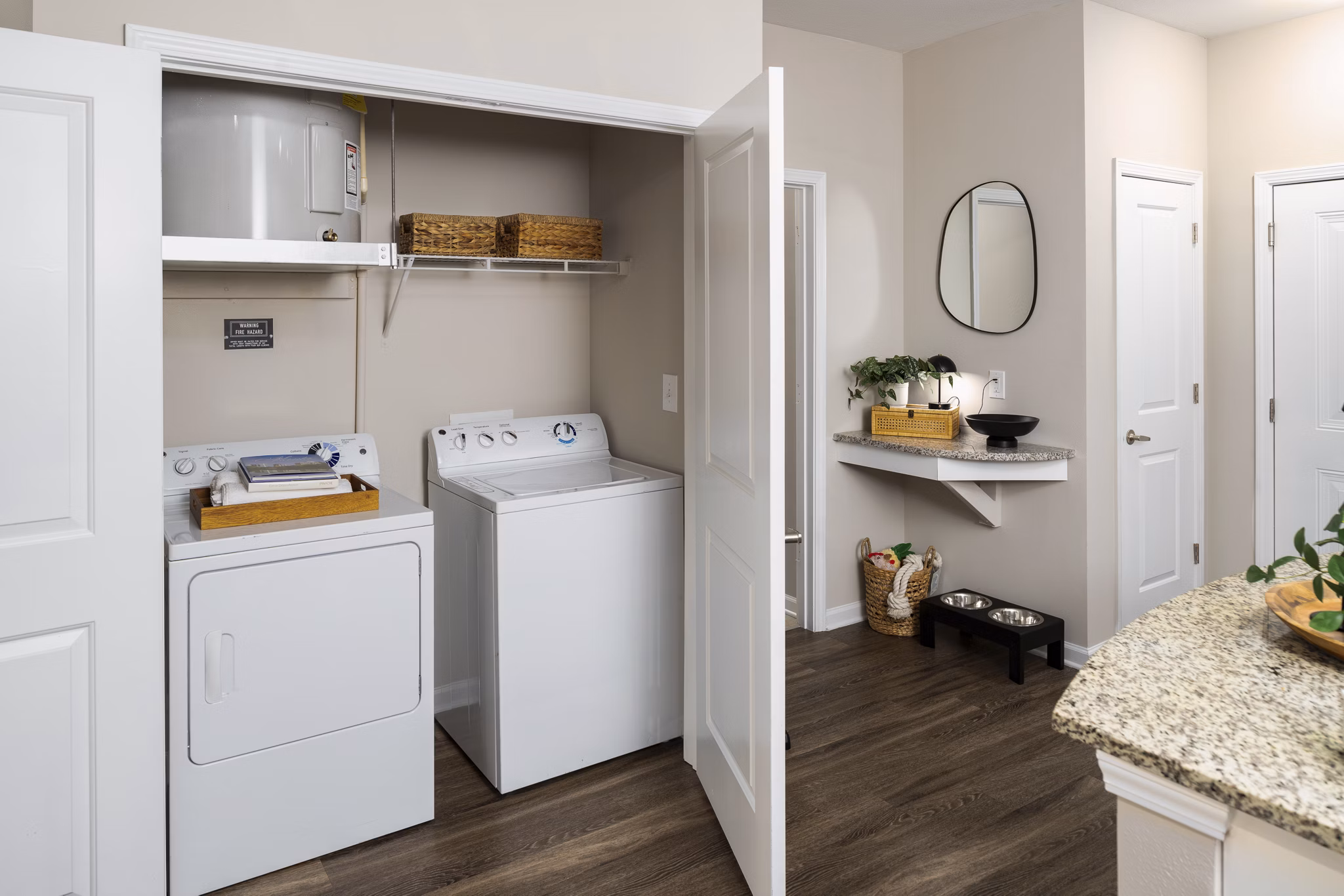 Laundry room featuring modern appliances at Avanti Brookhaven Apartments