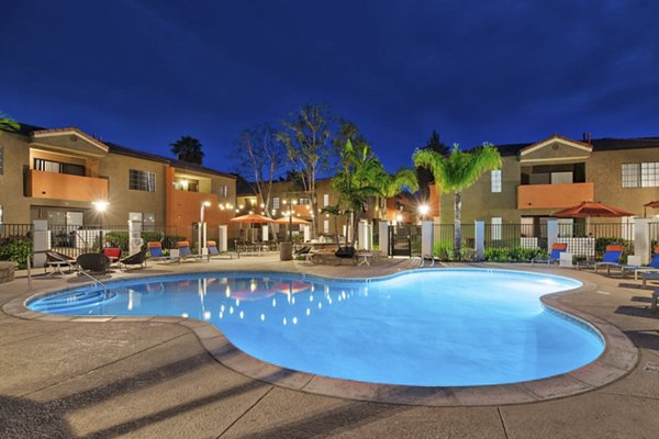 Outdoor pool surrounded by lush landscaping at The Ranch at Moorpark Apartments