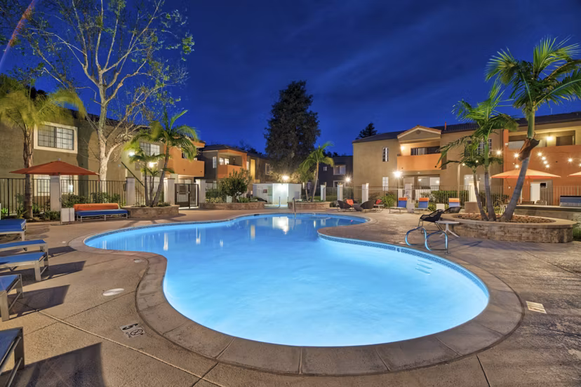 Pool with surrounding lounge chairs at The Ranch at Moorpark Apartments, offering luxury relaxation and recreational options