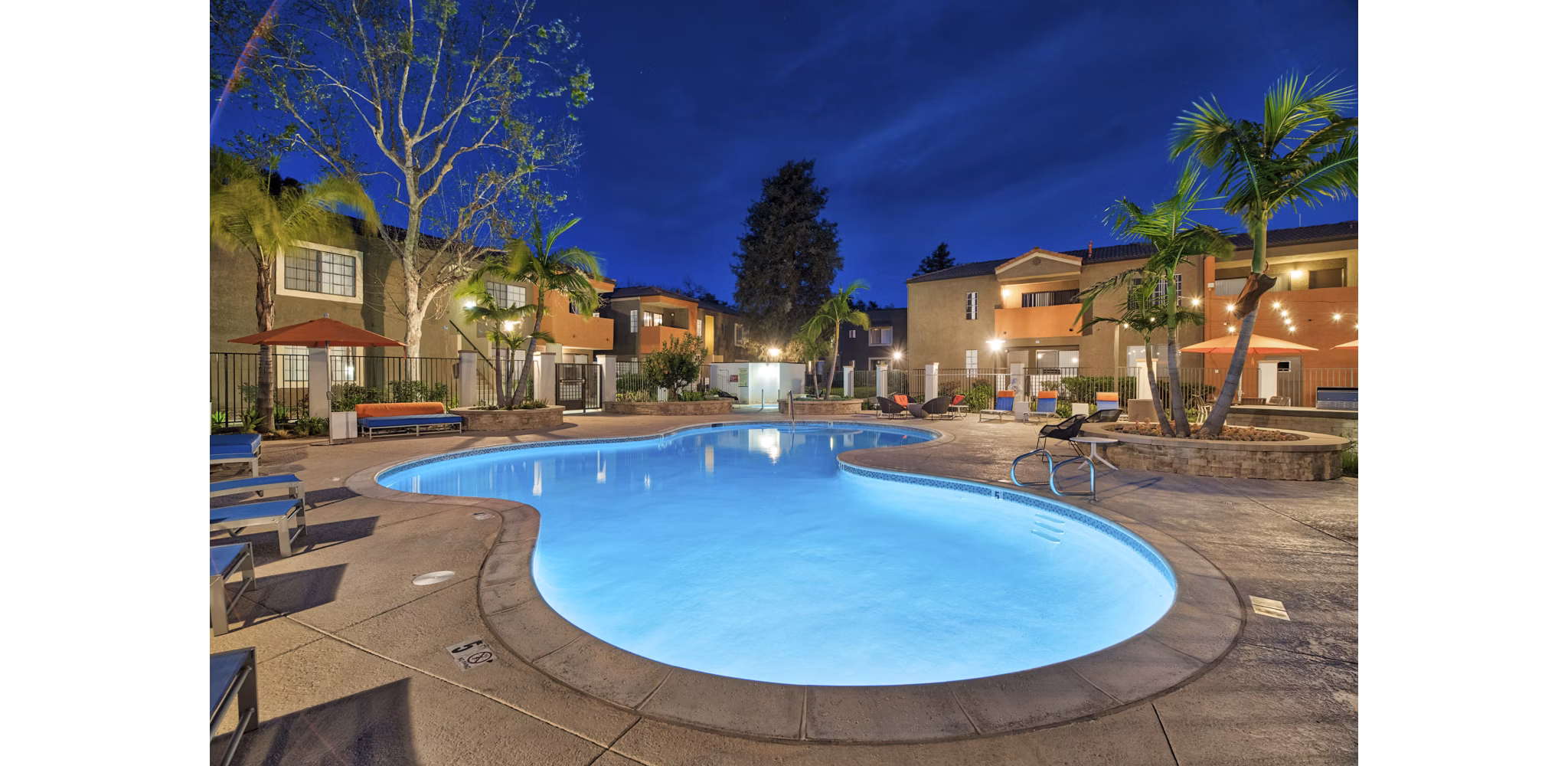 Pool with surrounding lounge chairs at The Ranch at Moorpark Apartments, offering luxury relaxation and recreational options