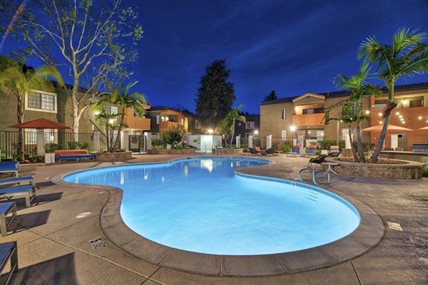 Pool with surrounding lounge chairs at The Ranch at Moorpark Apartments, offering luxury relaxation and recreational options