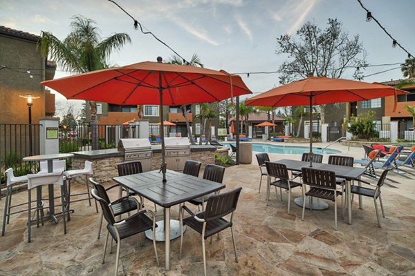 Grilling area with modern barbecue stations at The Ranch at Moorpark Apartments
