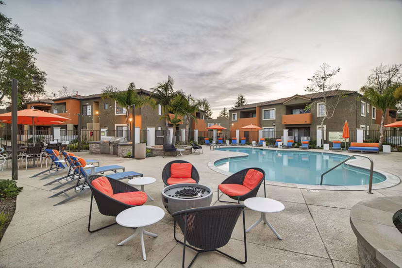 Fire pit surrounded by cozy seating at The Ranch at Moorpark Apartments, perfect for social gatherings and relaxation