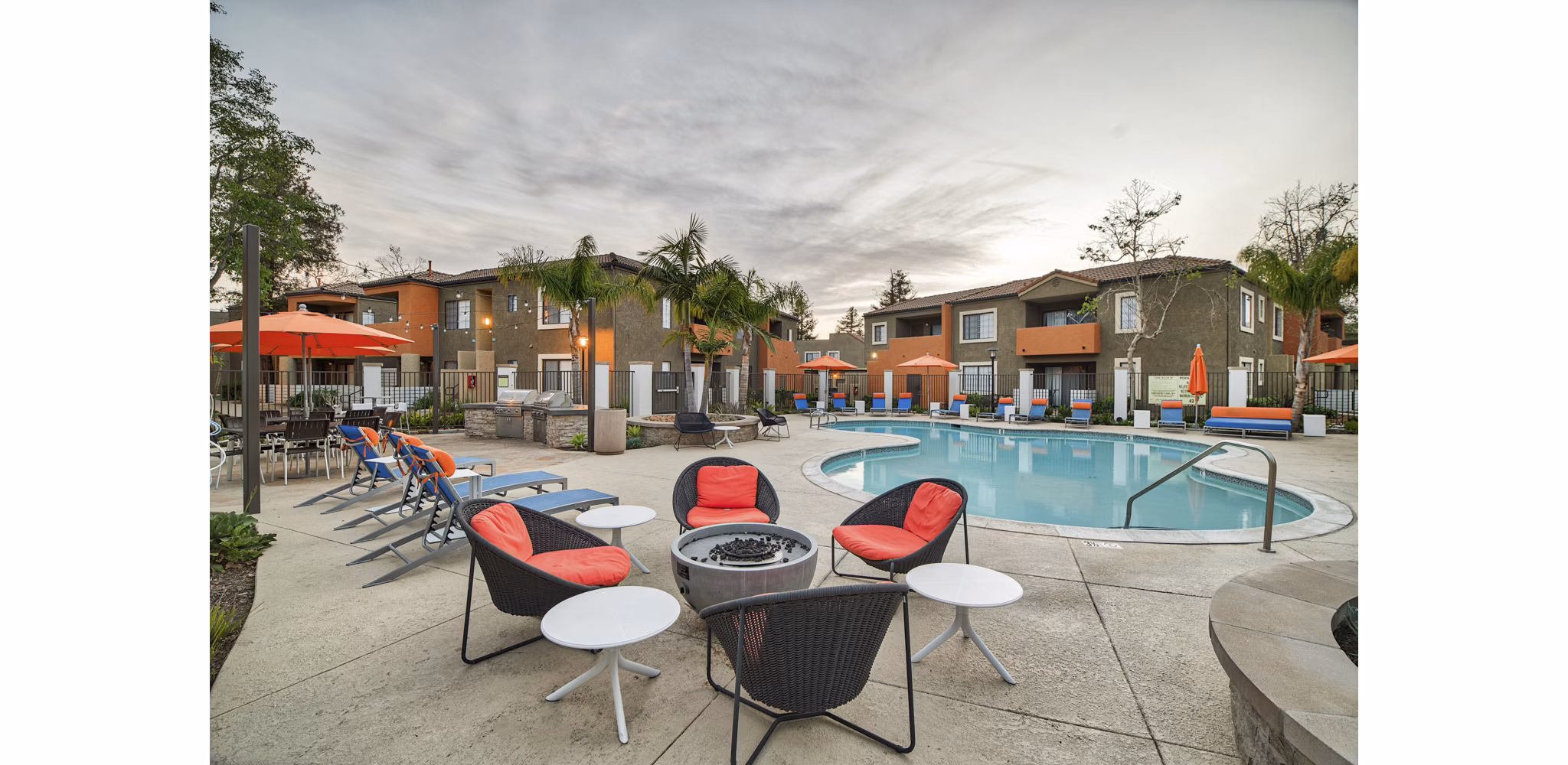 Fire pit surrounded by cozy seating at The Ranch at Moorpark Apartments, perfect for social gatherings and relaxation