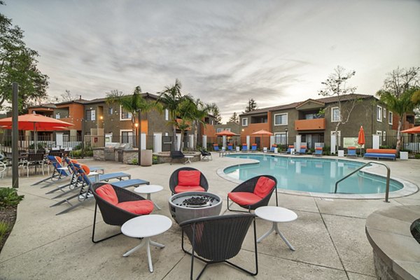 Fire pit surrounded by cozy seating at The Ranch at Moorpark Apartments, perfect for social gatherings and relaxation