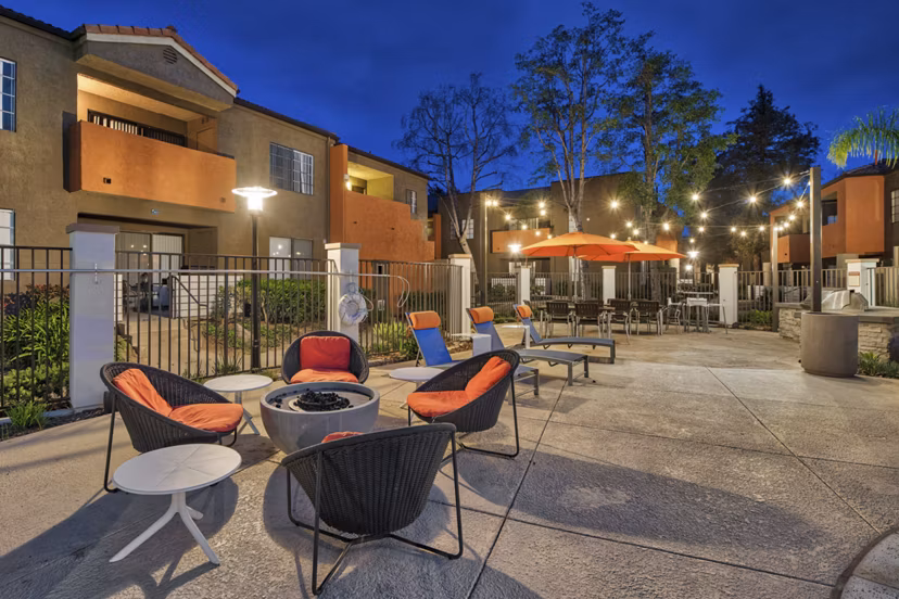 Cozy outdoor fire pit area at The Ranch at Moorpark Apartments, perfect for social gatherings and relaxation under the stars