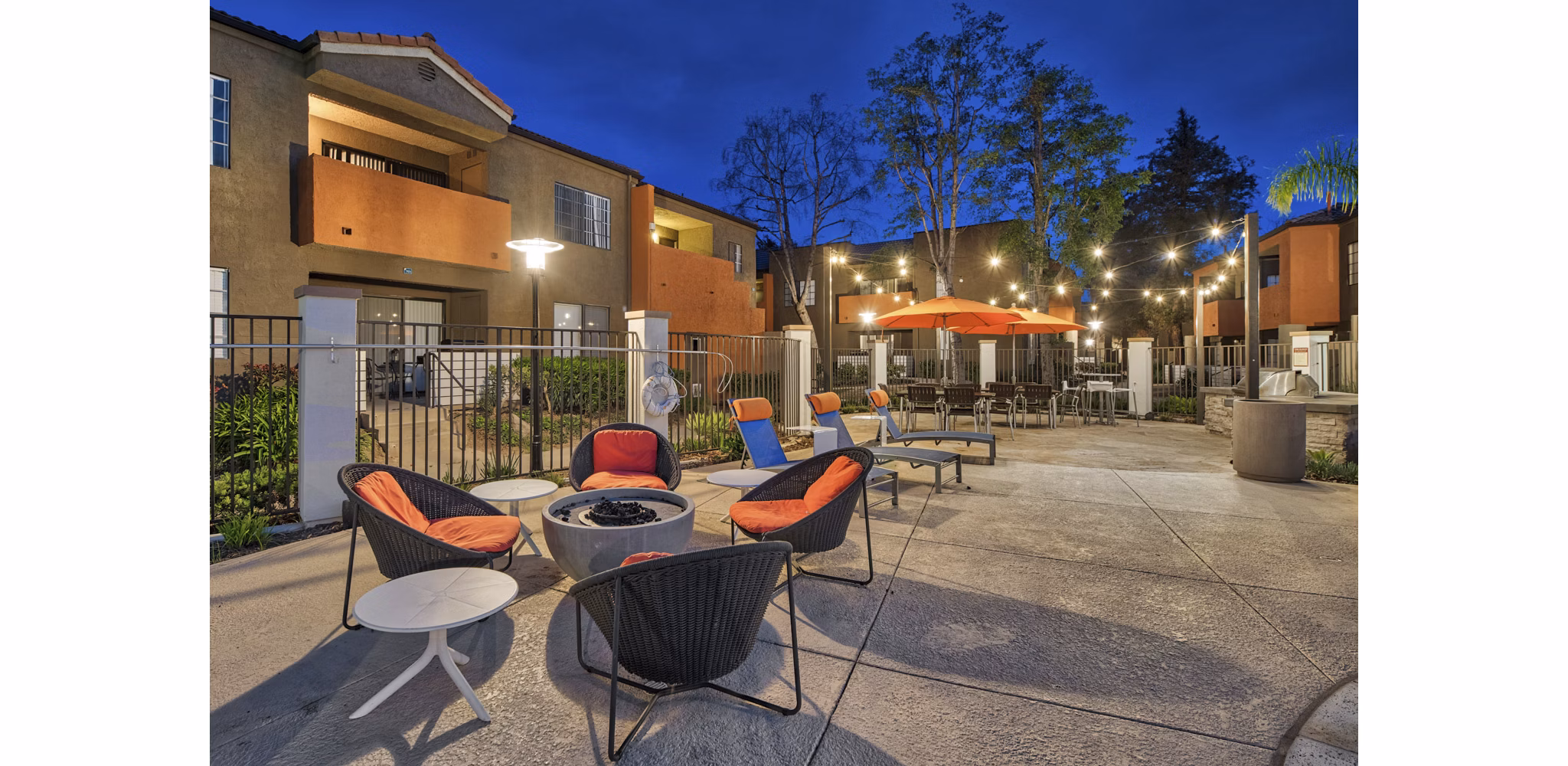 Cozy outdoor fire pit area at The Ranch at Moorpark Apartments, perfect for social gatherings and relaxation under the stars