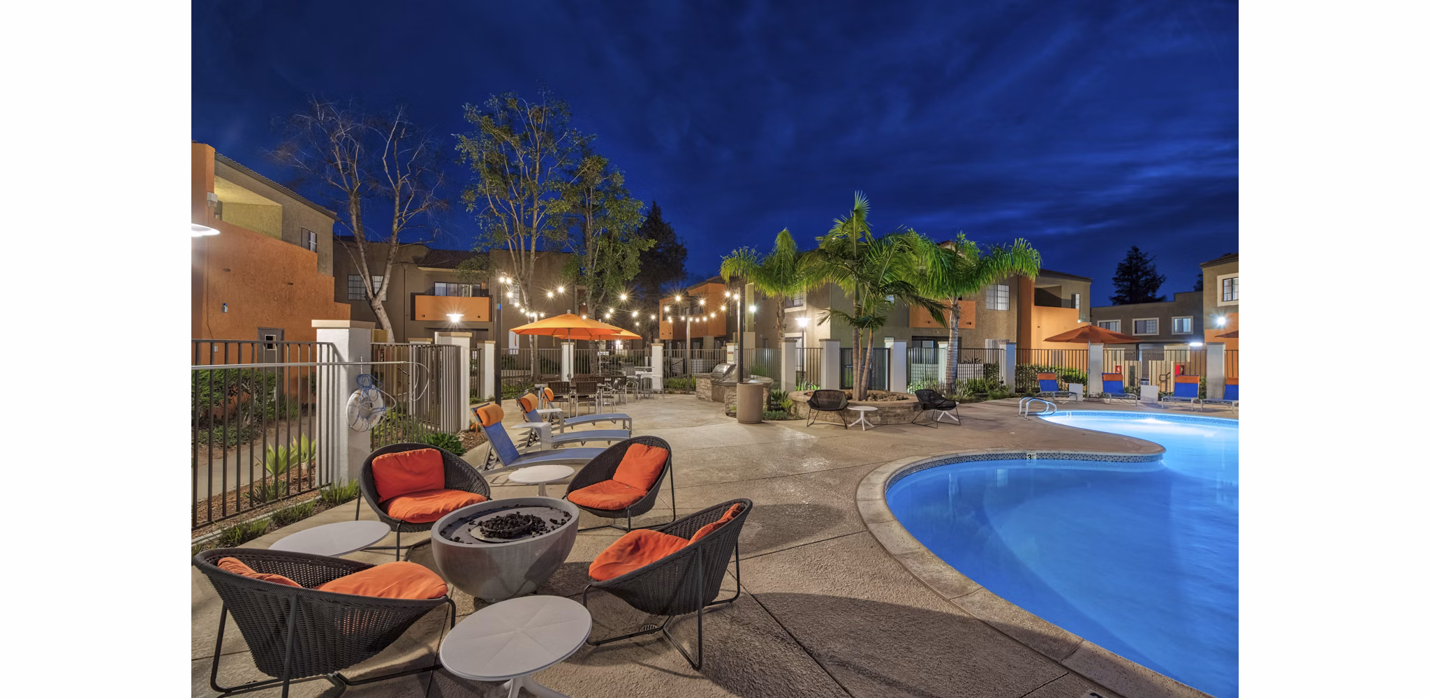 Fire pit area with cozy seating at The Ranch at Moorpark Apartments offering luxury outdoor amenities