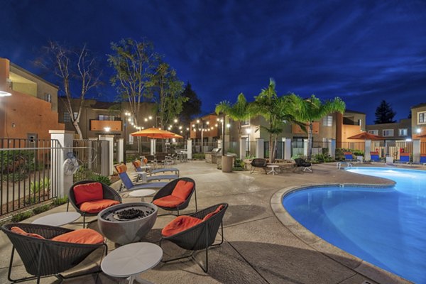 Fire pit area with cozy seating at The Ranch at Moorpark Apartments offering luxury outdoor amenities