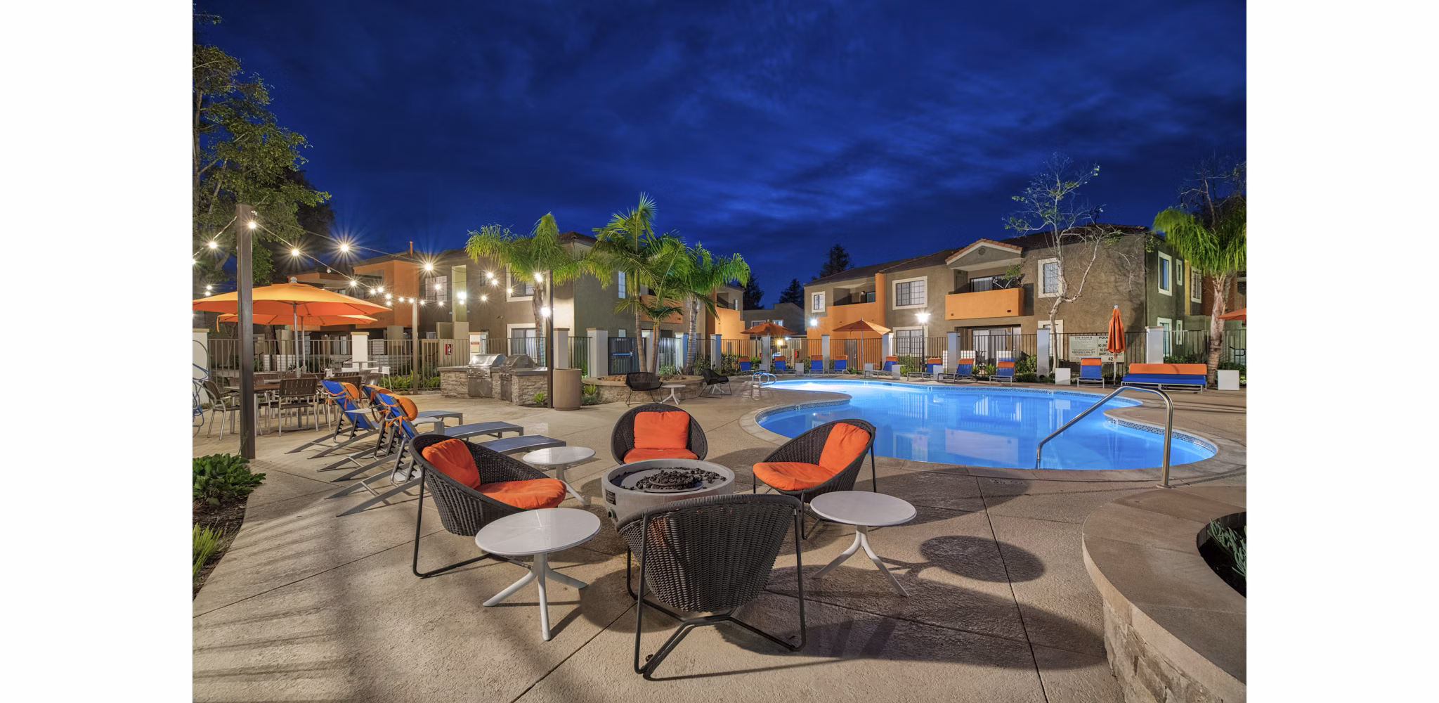 Fire pit surrounded by cozy seating at The Ranch at Moorpark Apartments, creating a warm outdoor gathering space