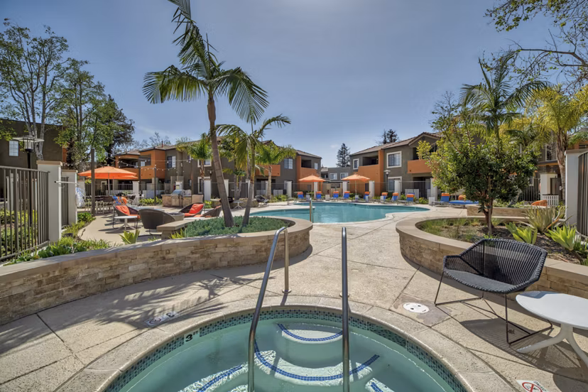 Relaxing pool area with lounge chairs at The Ranch at Moorpark Apartments, offering a luxury lifestyle experience