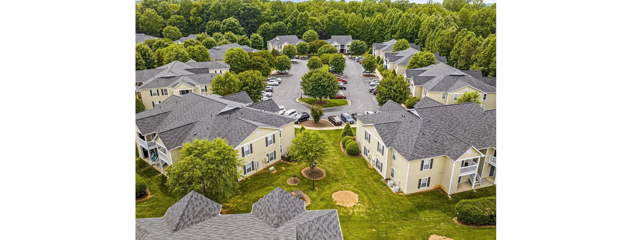 Fieldstone Apartment Homes: Elegant building set amidst lush greenery