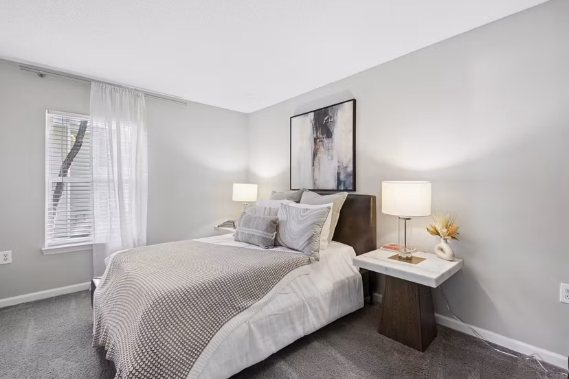 Spacious bedroom with modern furniture at Fieldstone Apartment Homes