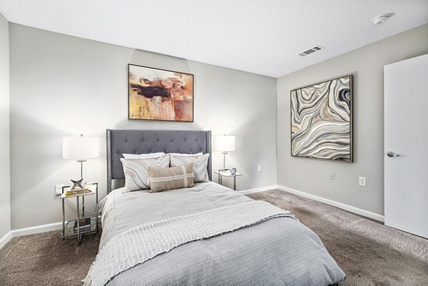 Spacious bedroom with modern furniture at Fieldstone Apartment Homes