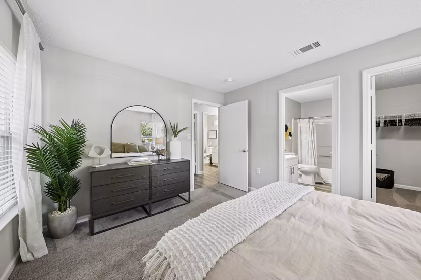 Elegant bedroom featuring chic decor and plush bedding in Fieldstone Apartment Homes