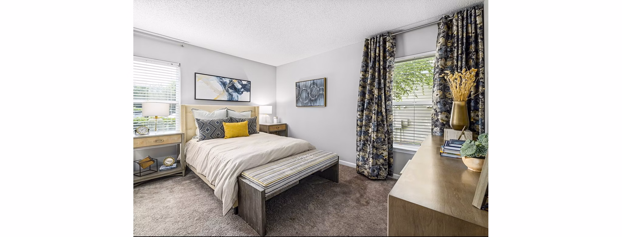 Elegant bedroom featuring chic decor and plush bedding in Fieldstone Apartment Homes