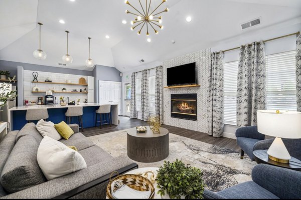 Clubhouse with modern seating and entertainment facilities at Fieldstone Apartment Homes, offering luxury living spaces