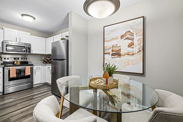 Dining room with modern decor and elegant lighting at Fieldstone Apartment Homes