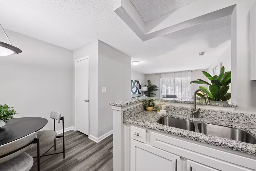 Dining room featuring elegant dÃ©cor and modern lighting at Fieldstone Apartment Homes, a luxury apartment by Greystar