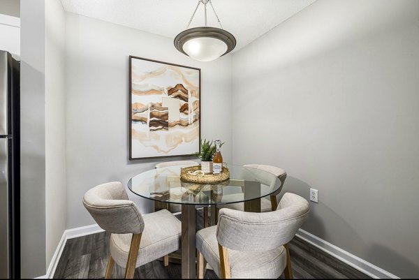 Dining room featuring elegant dÃ©cor and modern lighting at Fieldstone Apartment Homes, a luxury apartment by Greystar