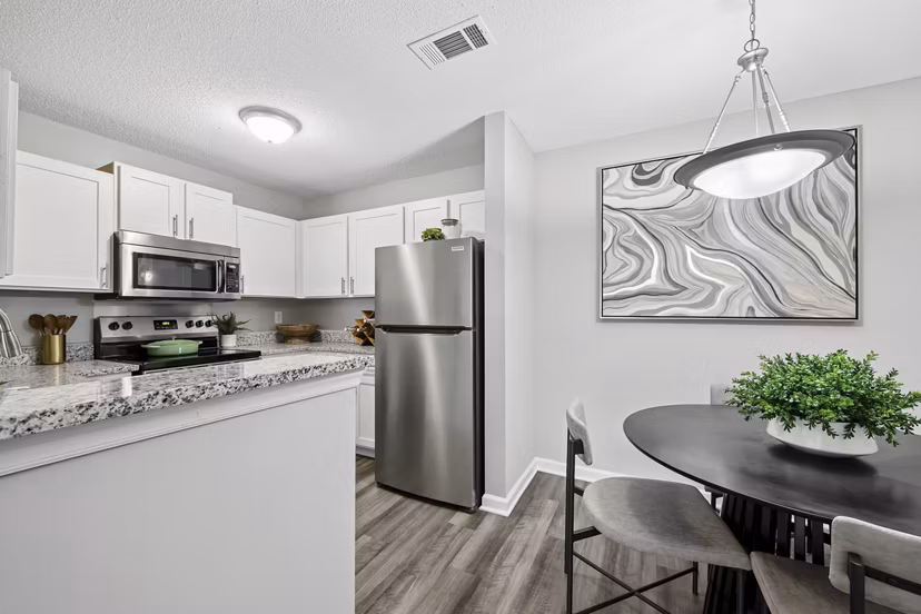 Modern kitchen with stainless steel appliances and granite countertops at Fieldstone Apartment Homes