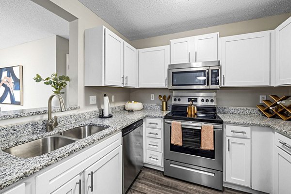 Modern kitchen with stainless steel appliances and granite countertops at Fieldstone Apartment Homes