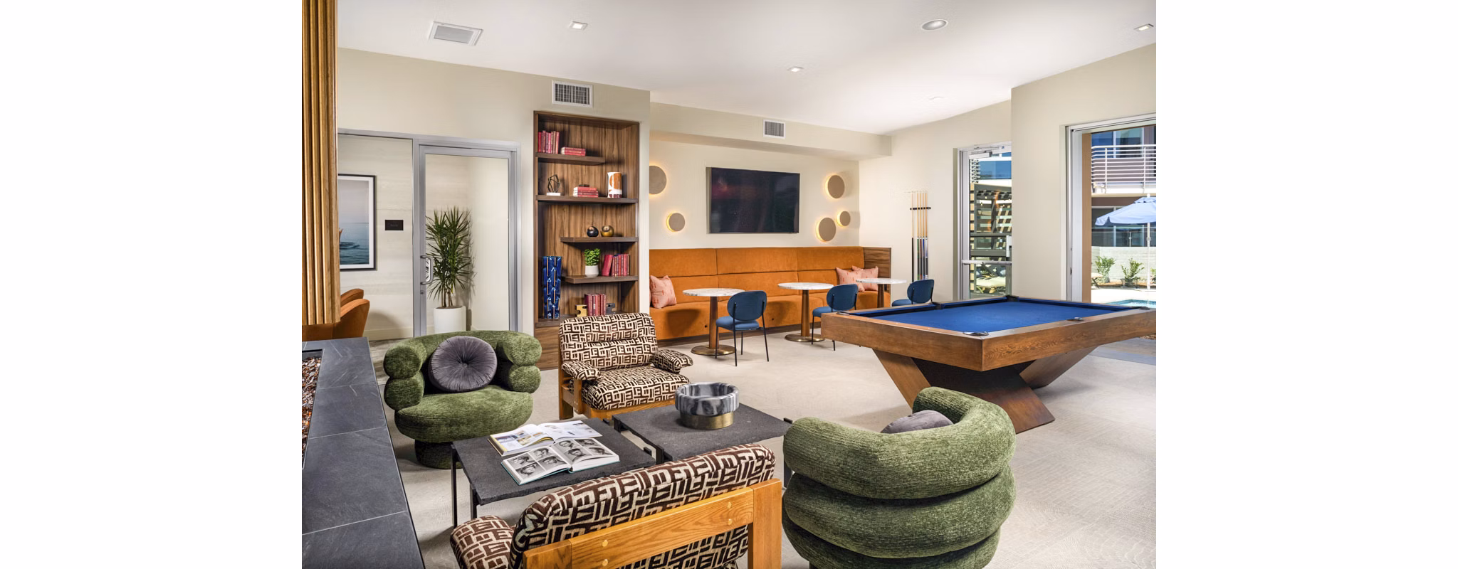 Inviting clubhouse with modern furnishings at Triton Encinitas Apartments, ideal for resident gatherings and community events