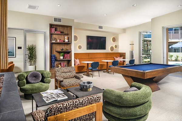 Inviting clubhouse with modern furnishings at Triton Encinitas Apartments, ideal for resident gatherings and community events