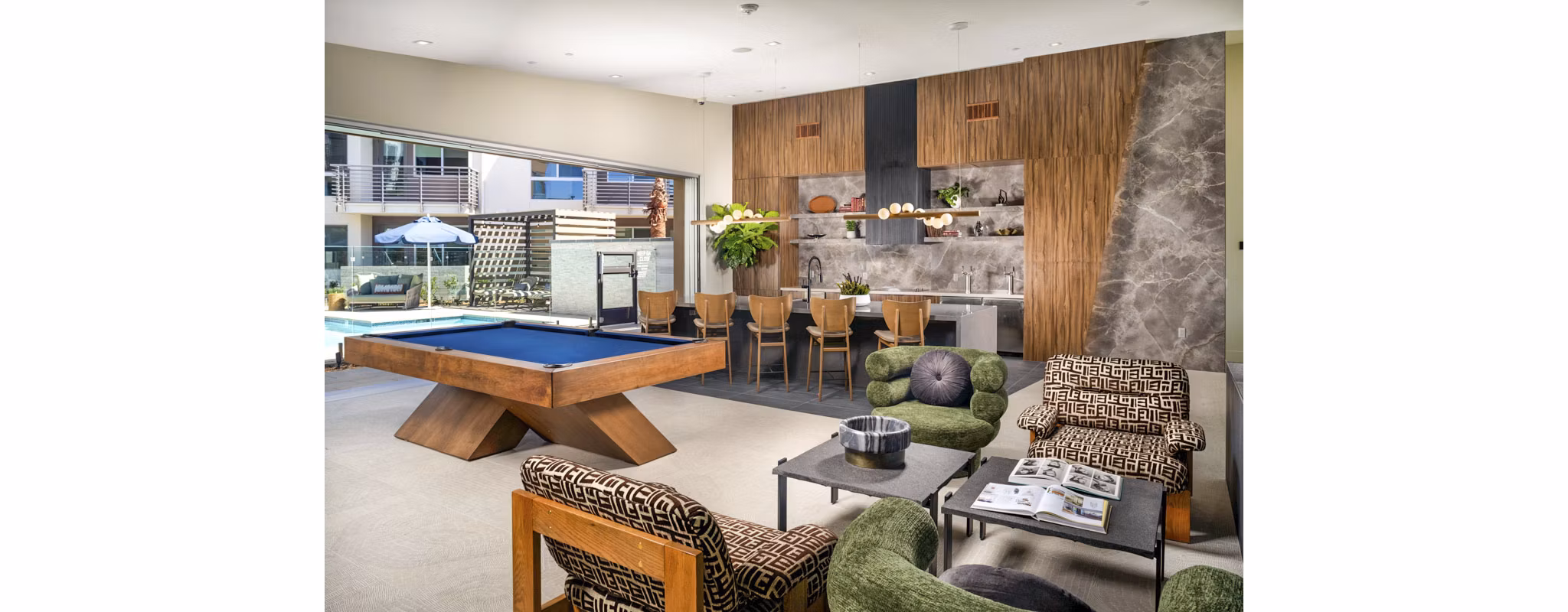 Modern clubhouse featuring plush seating and communal workspaces at Triton Encinitas Apartments