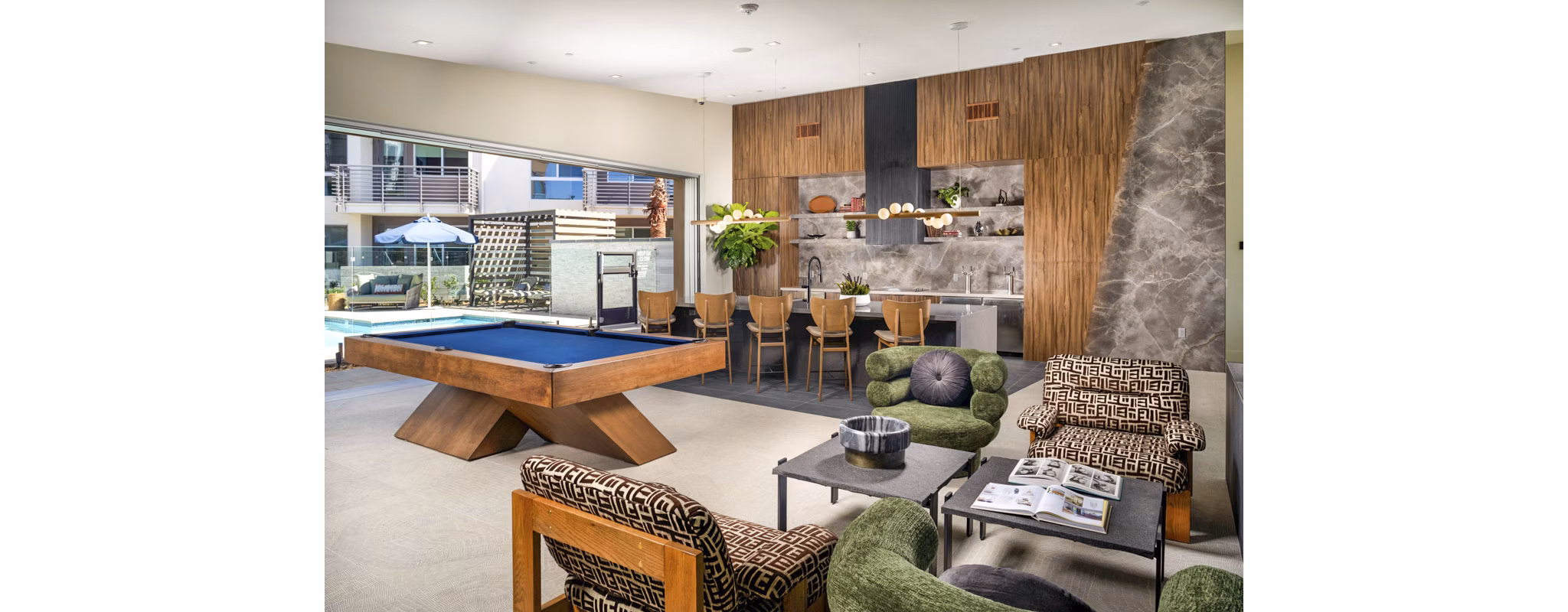 Modern clubhouse featuring plush seating and communal workspaces at Triton Encinitas Apartments