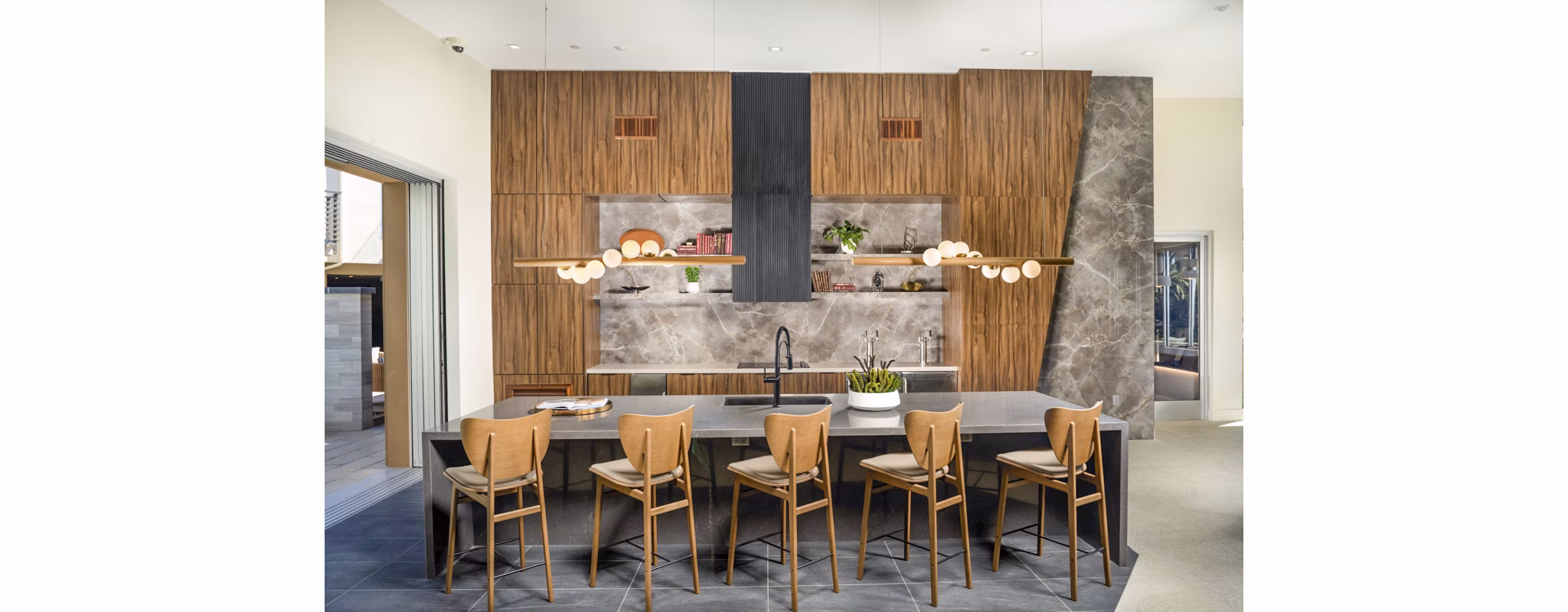 Modern clubhouse with lounge seating at Triton Encinitas Apartments, showcasing luxury amenities in coastal California living