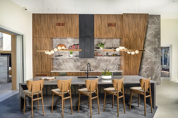Modern clubhouse with lounge seating at Triton Encinitas Apartments, showcasing luxury amenities in coastal California living