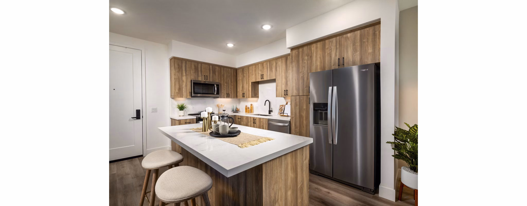 Modern kitchen with stainless steel appliances at Triton Encinitas Apartments