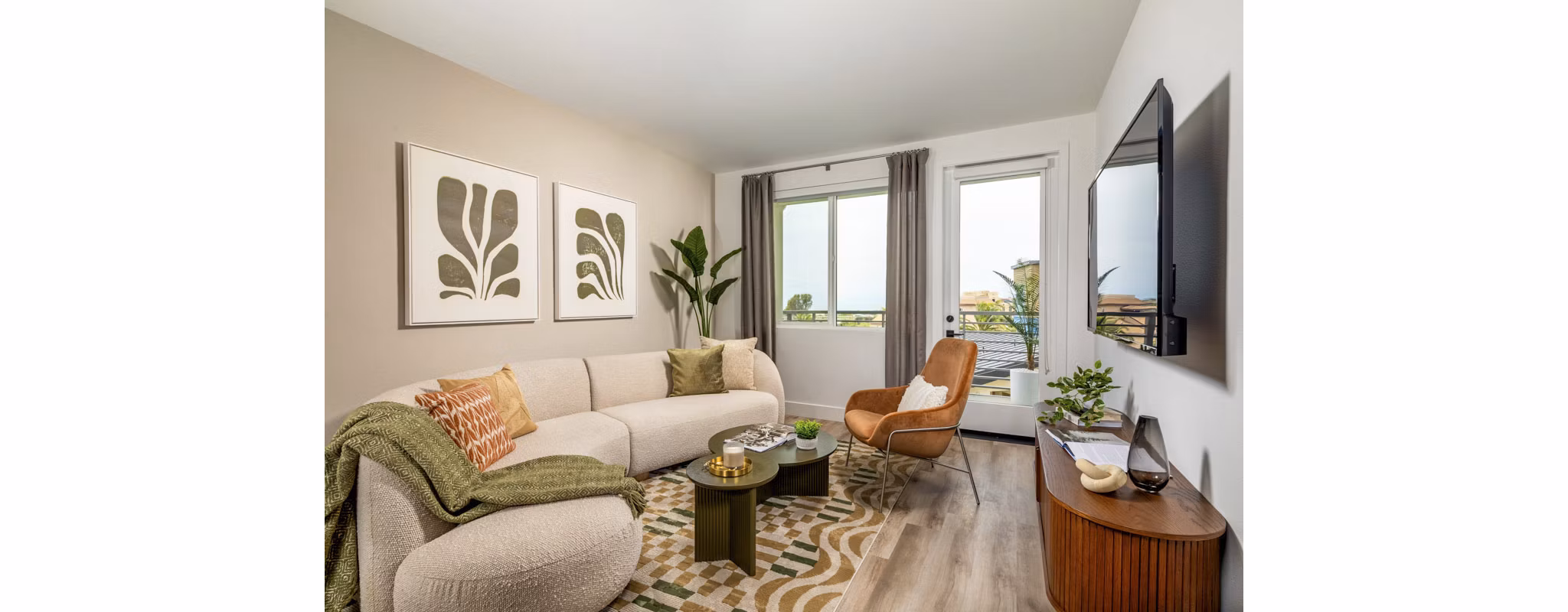Cozy living room with modern decor and natural light at Triton Encinitas Apartments