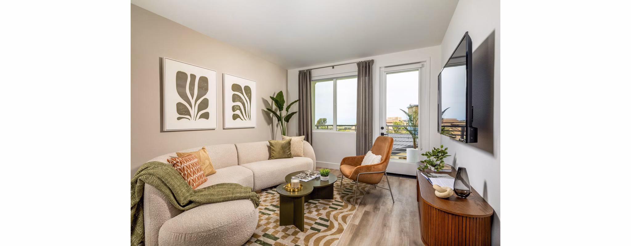 Cozy living room with modern decor and natural light at Triton Encinitas Apartments