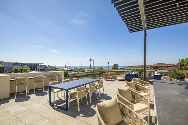 Spacious patio with stylish seating at Triton Encinitas Apartments, perfect for relaxing and enjoying views in luxury