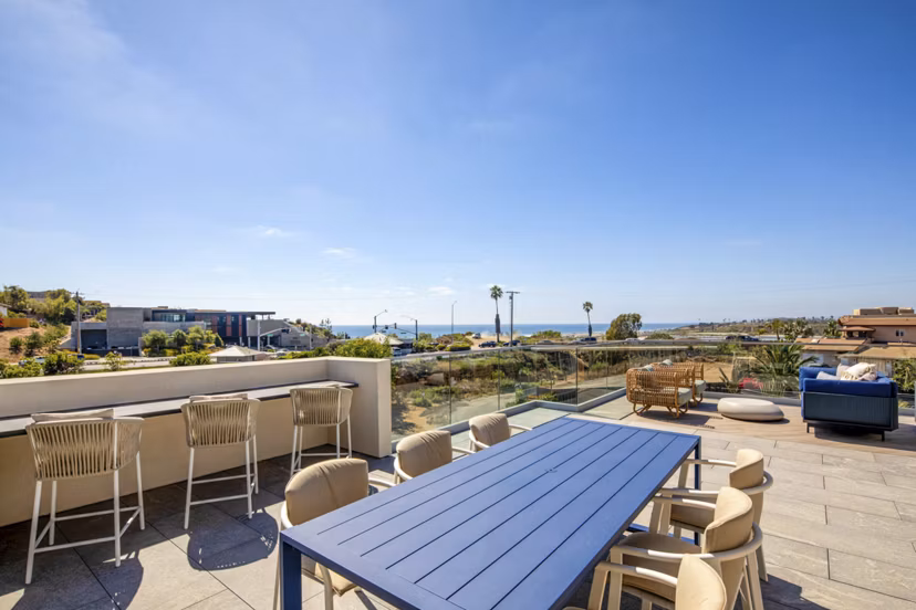Patio with cozy seating and ocean views at Triton Encinitas Apartments, luxury living by the coast in the vibrant Encinitas community