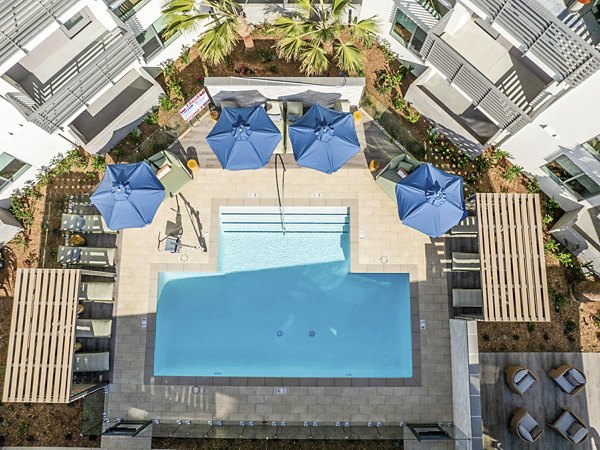 Inviting pool area at Triton Encinitas Apartments offering luxury relaxation and leisure spaces in a scenic setting