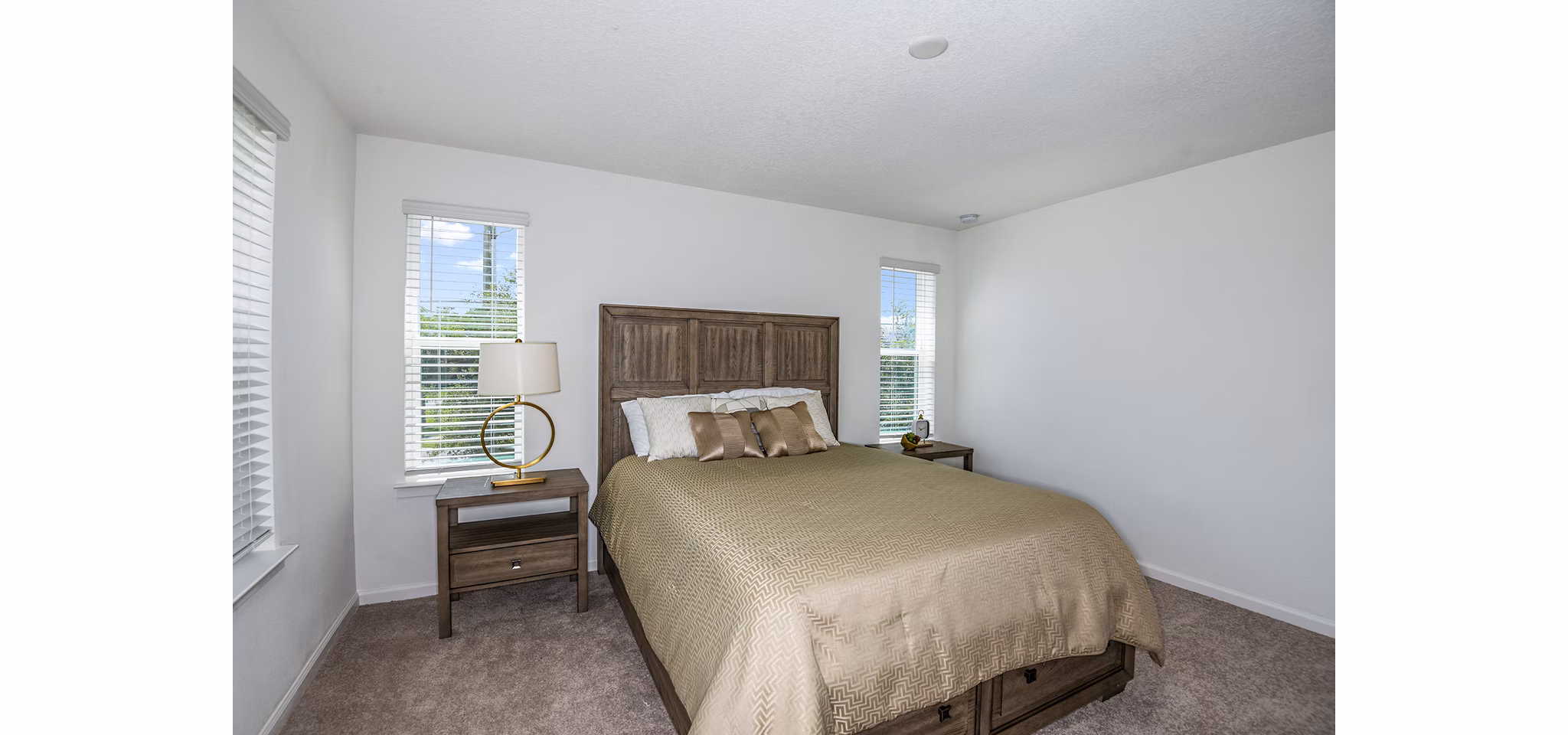 Bedroom with elegant design and modern furnishings at Alexander Park Apartments